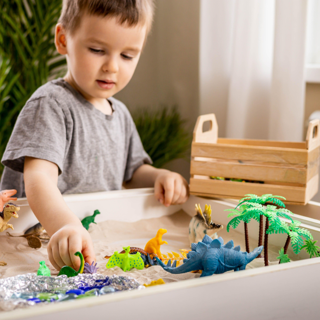 A boy playing with sensory toys