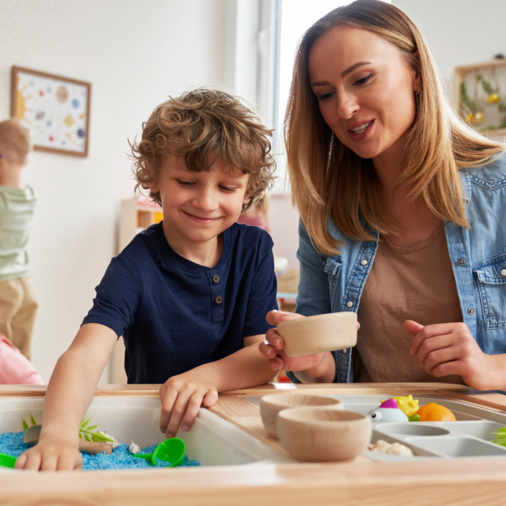 A mother playing with sensory toys with her son