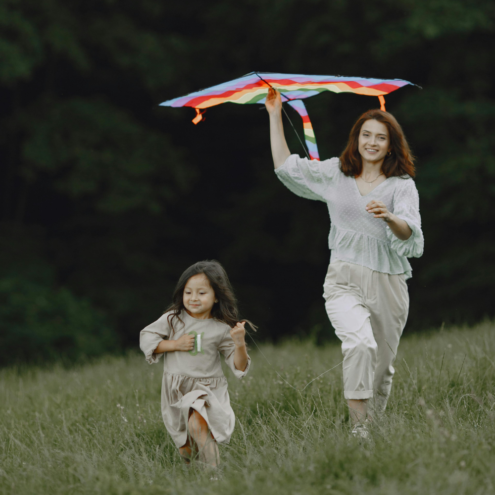 Toddler tantrums, a mother is outside with her daughter flying a kite