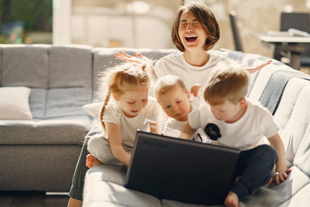 A mother is laughing together with her kids