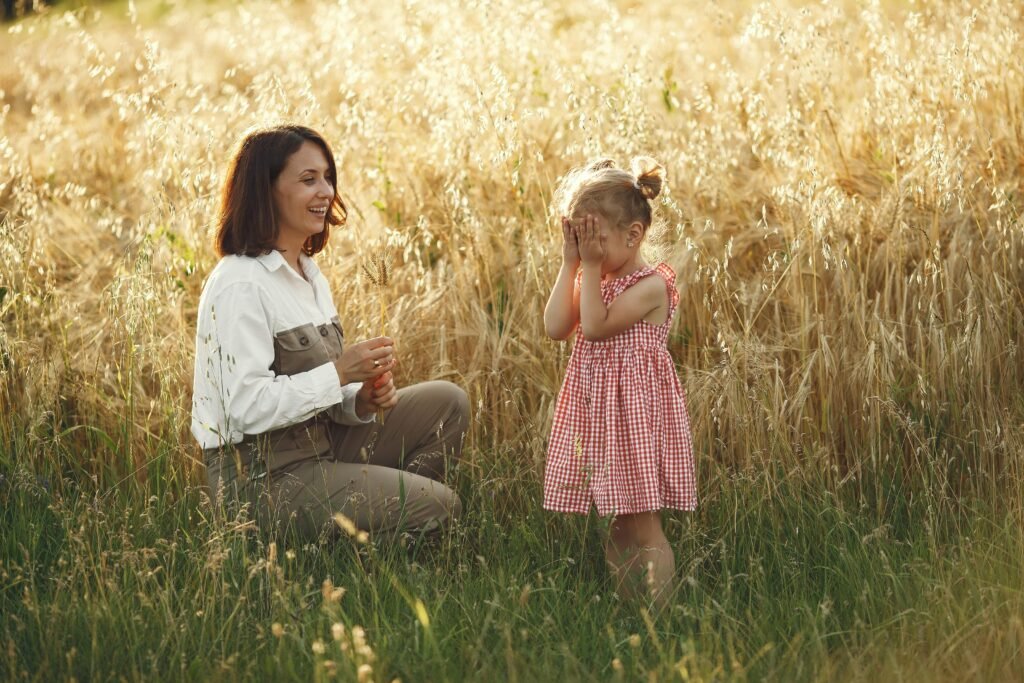 Gentle vs. Tiger parenting, a mom is in a field with her daughter