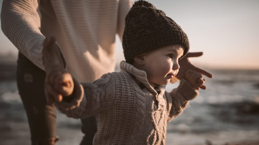A mother is out walking with her son near the lake gentle parenting vs conscious parenting