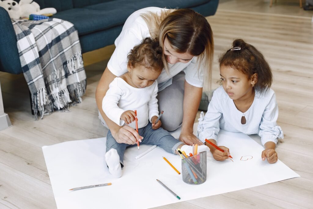 Parent and children working on a creative activity together